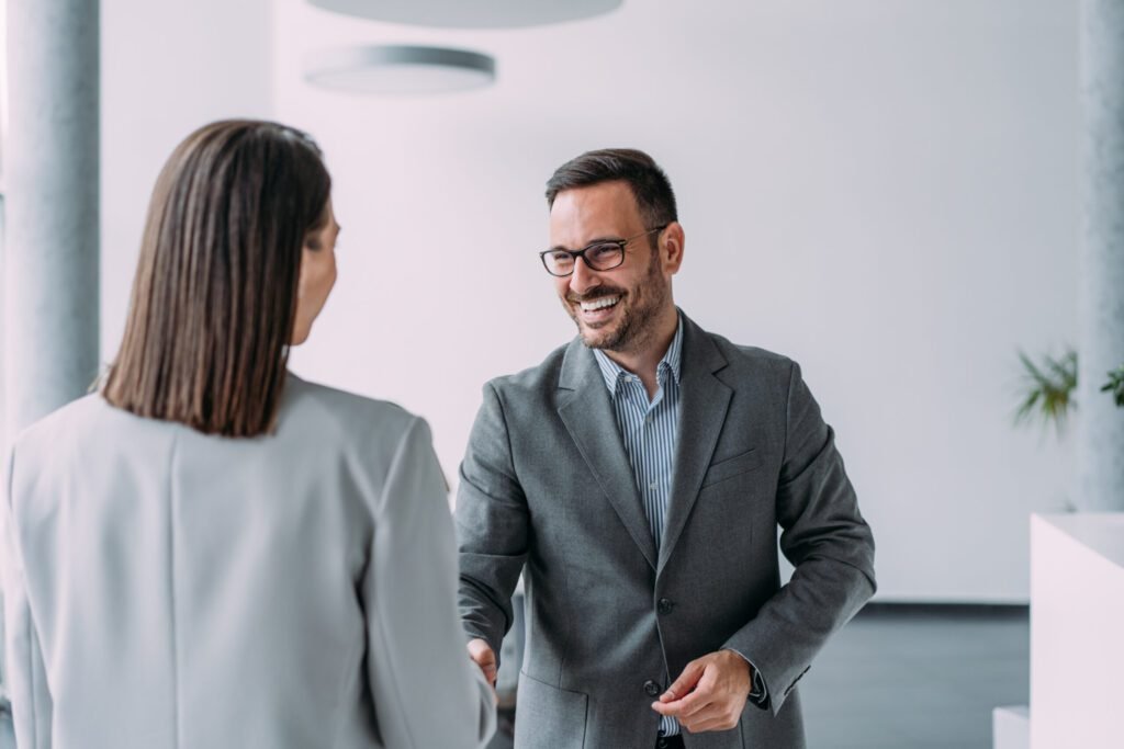 A man greeting a woman
