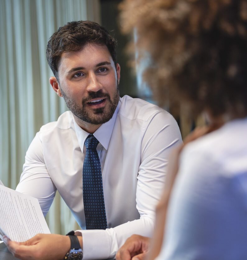 Man with a tie on in a meeting