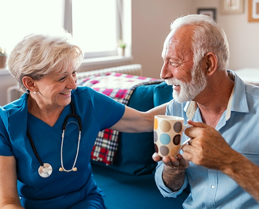 Elderly man and carer