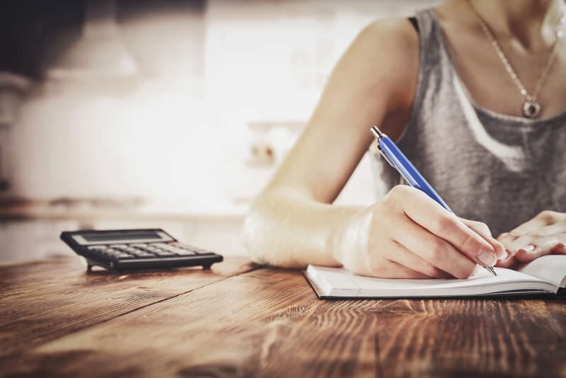 Woman with pen and paper