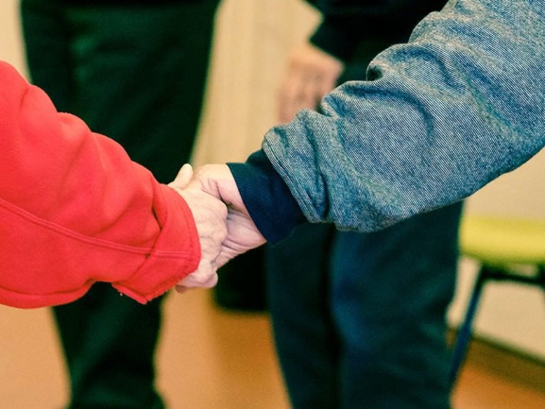 Two people shaking hands.