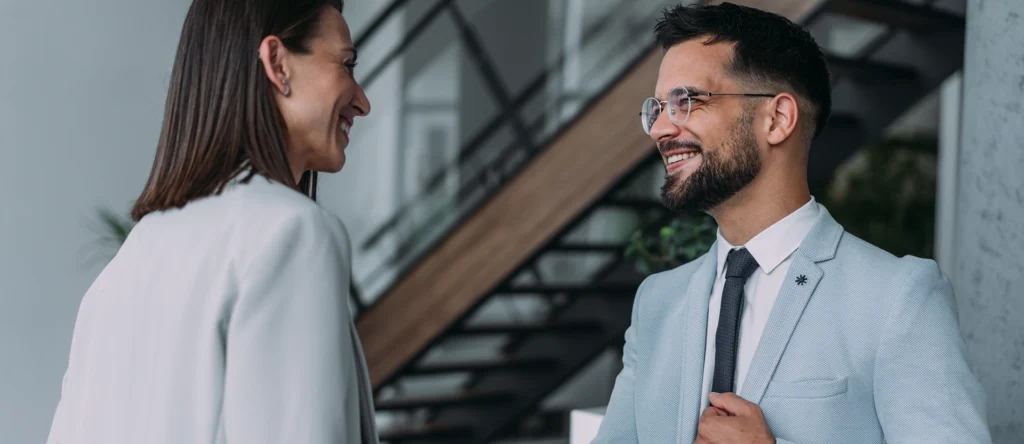 A client and a legal professional working together and smiling.