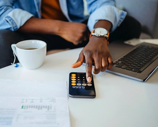 Man using calculator